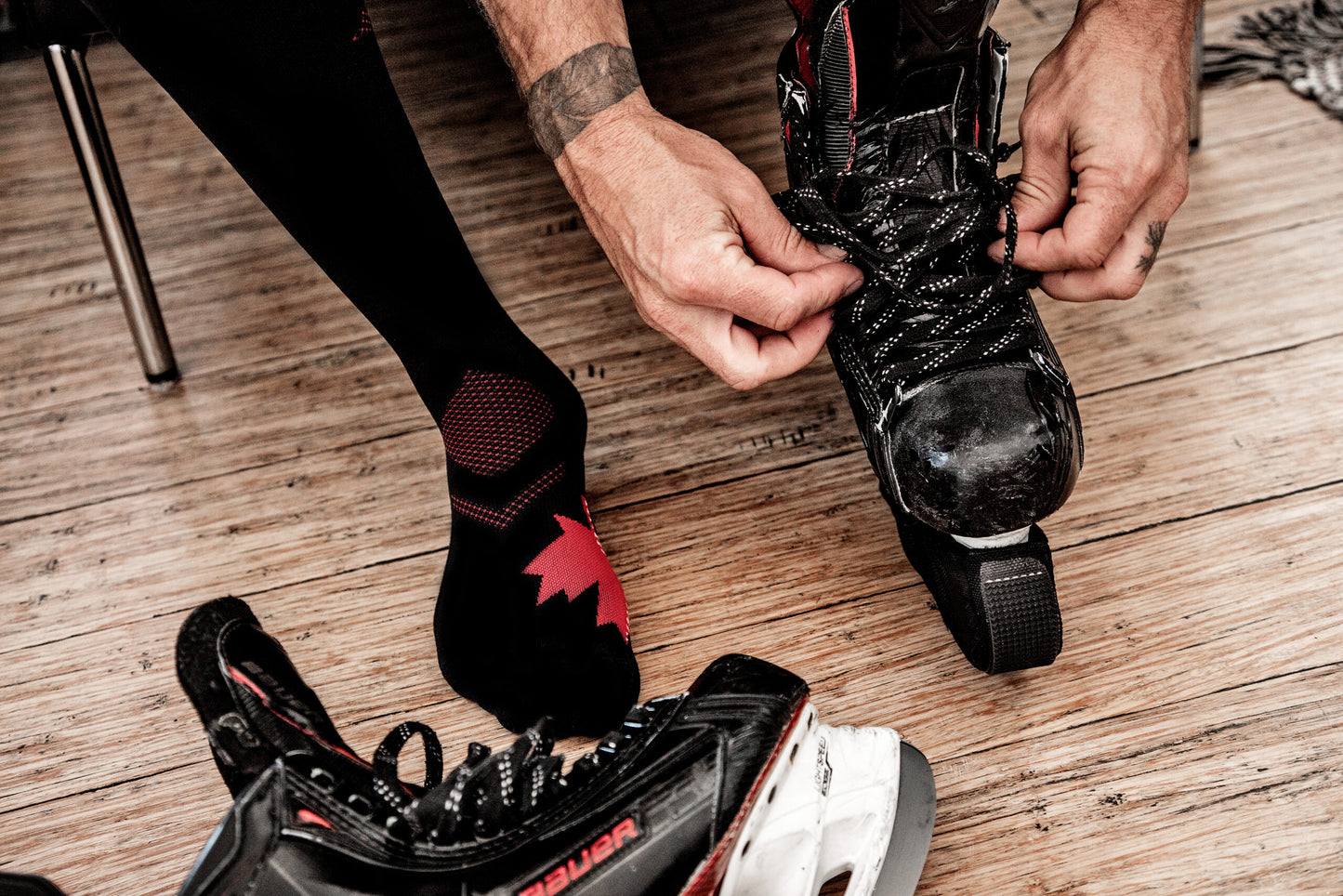 Model in Lunatik Strong 'N Free 1 compression socks putting on roller skates.