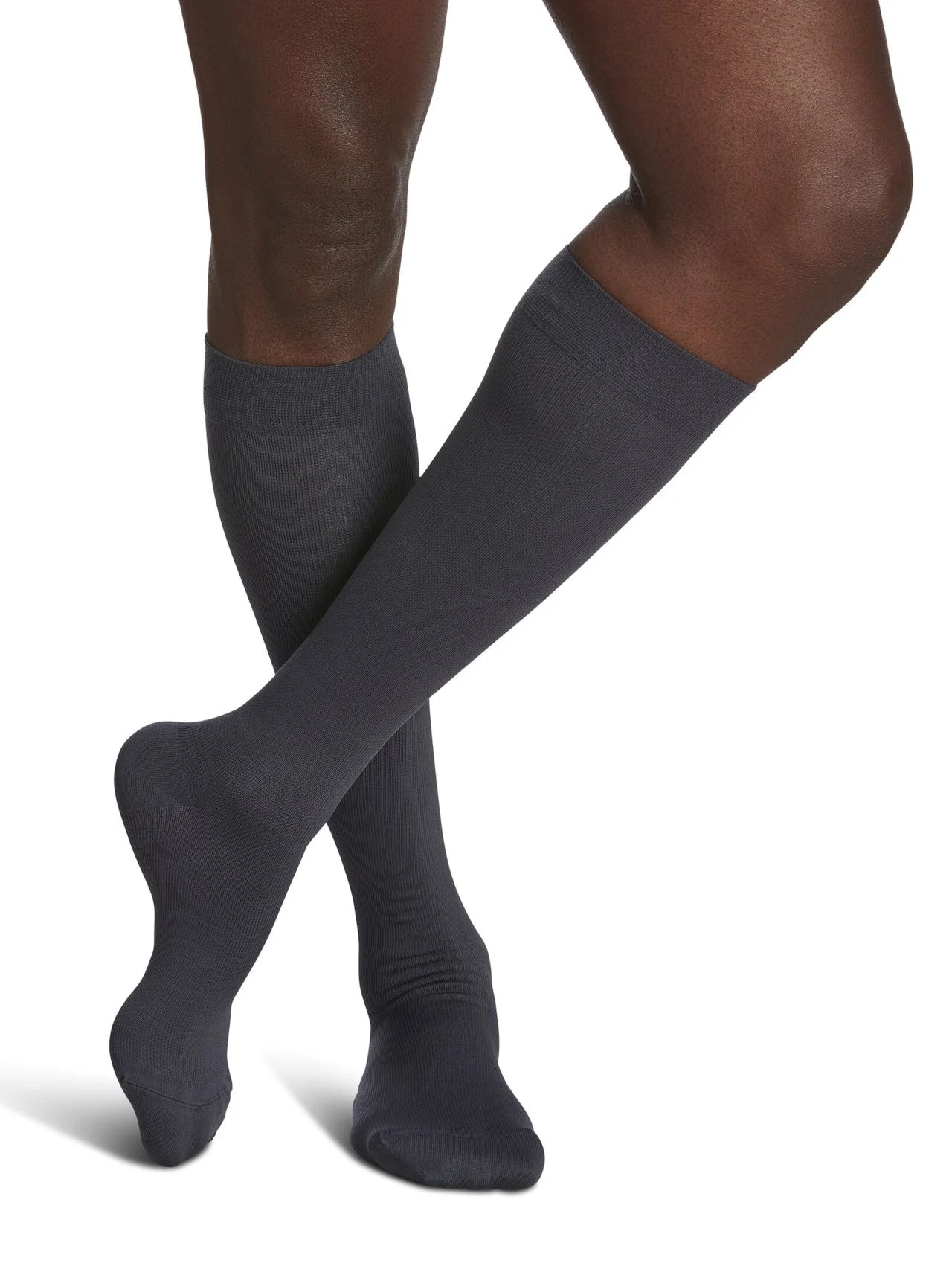 Legs of model in Sigvaris Men's Microfiber compression calf socks in steel grey.