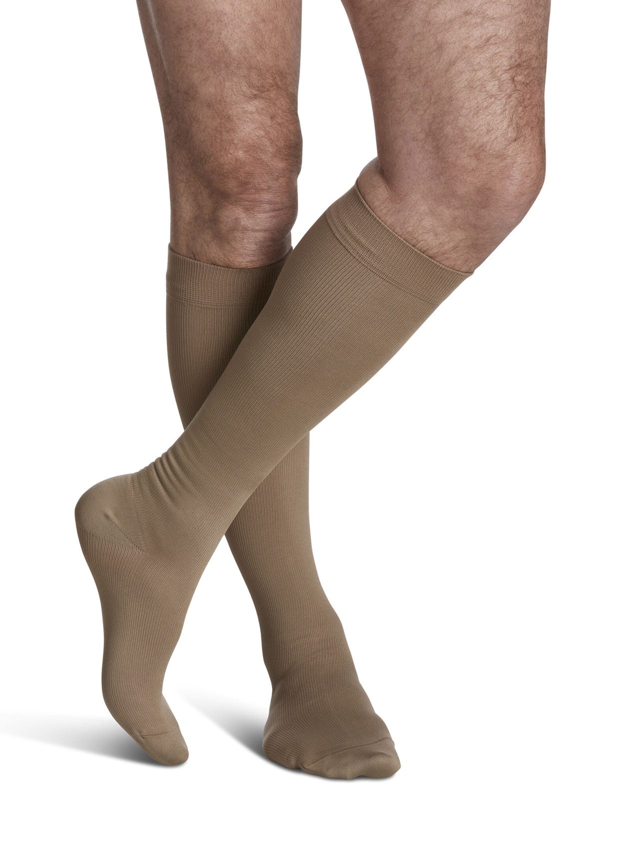 Legs of model in Sigvaris Men's Microfiber compression calf socks in tan-khaki.