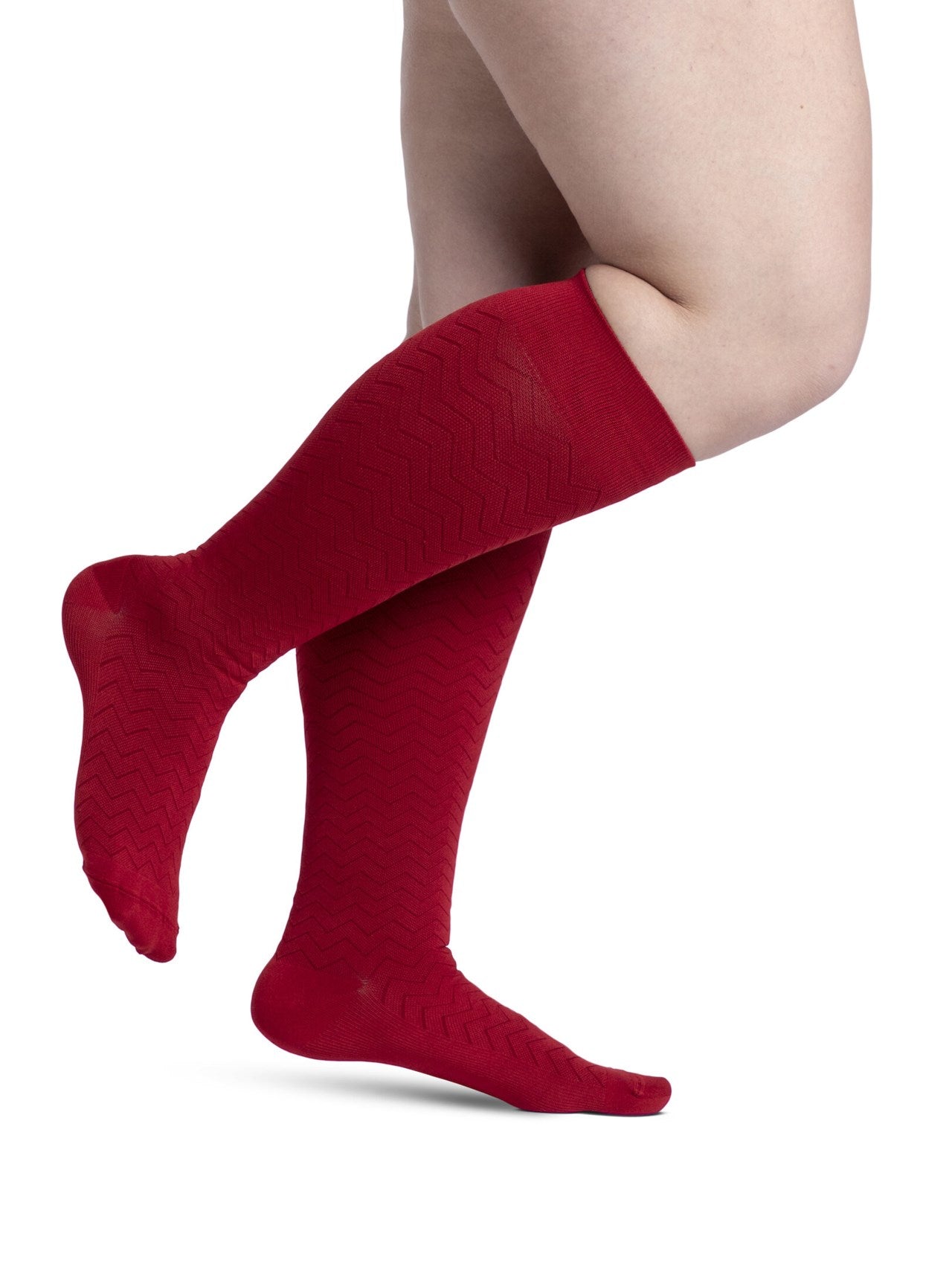 Legs of female model in Sigvaris Microfiber Patterns compression socks in cranberry.