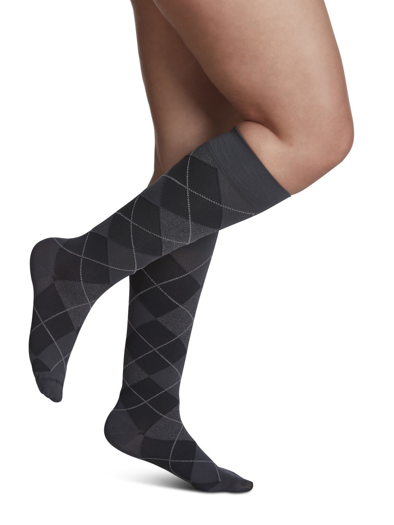 Legs of female model in Sigvaris Microfiber Patterns compression socks in graphite argyle.