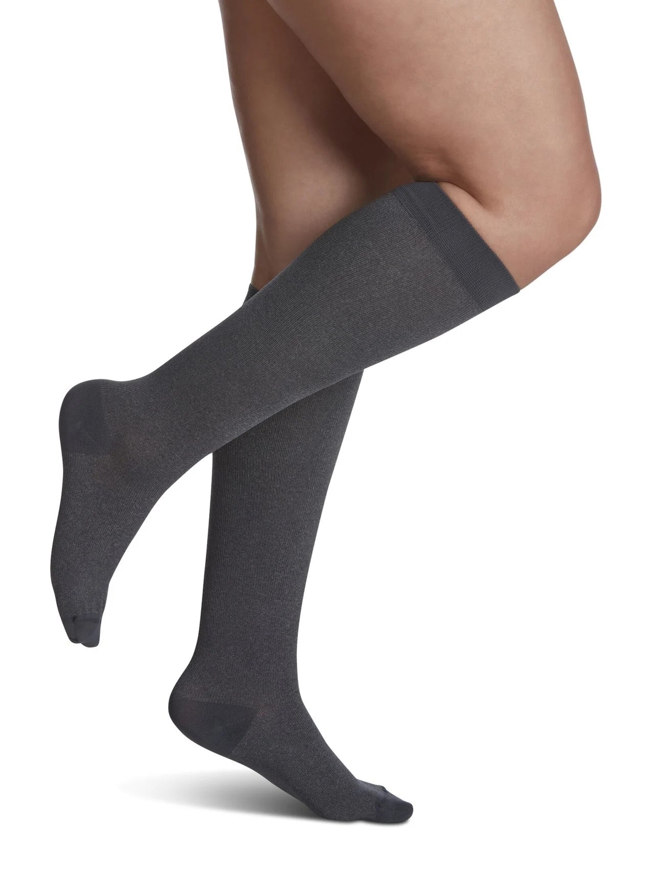Legs of female model in Sigvaris Microfiber Patterns compression socks in graphite heather.