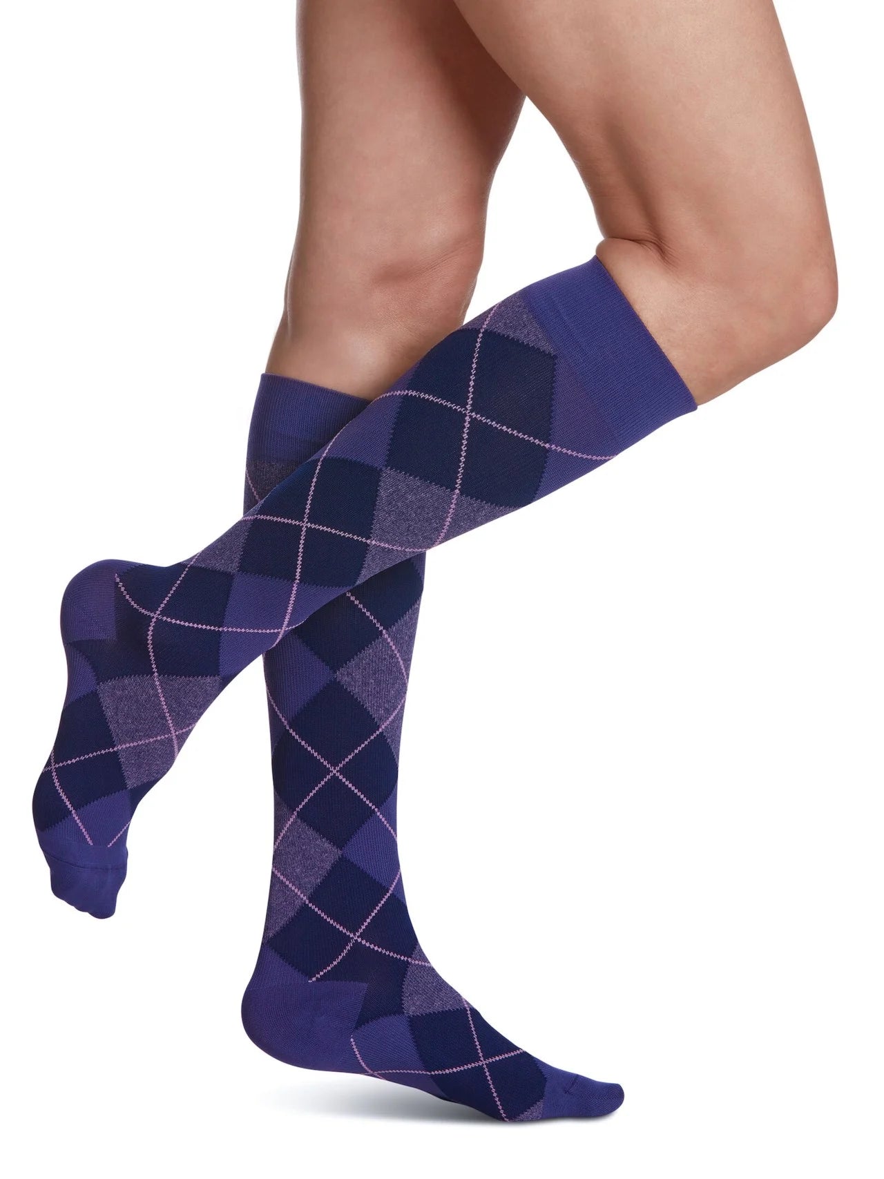 Legs of female model in Sigvaris Microfiber Patterns compression socks in purple argyle.