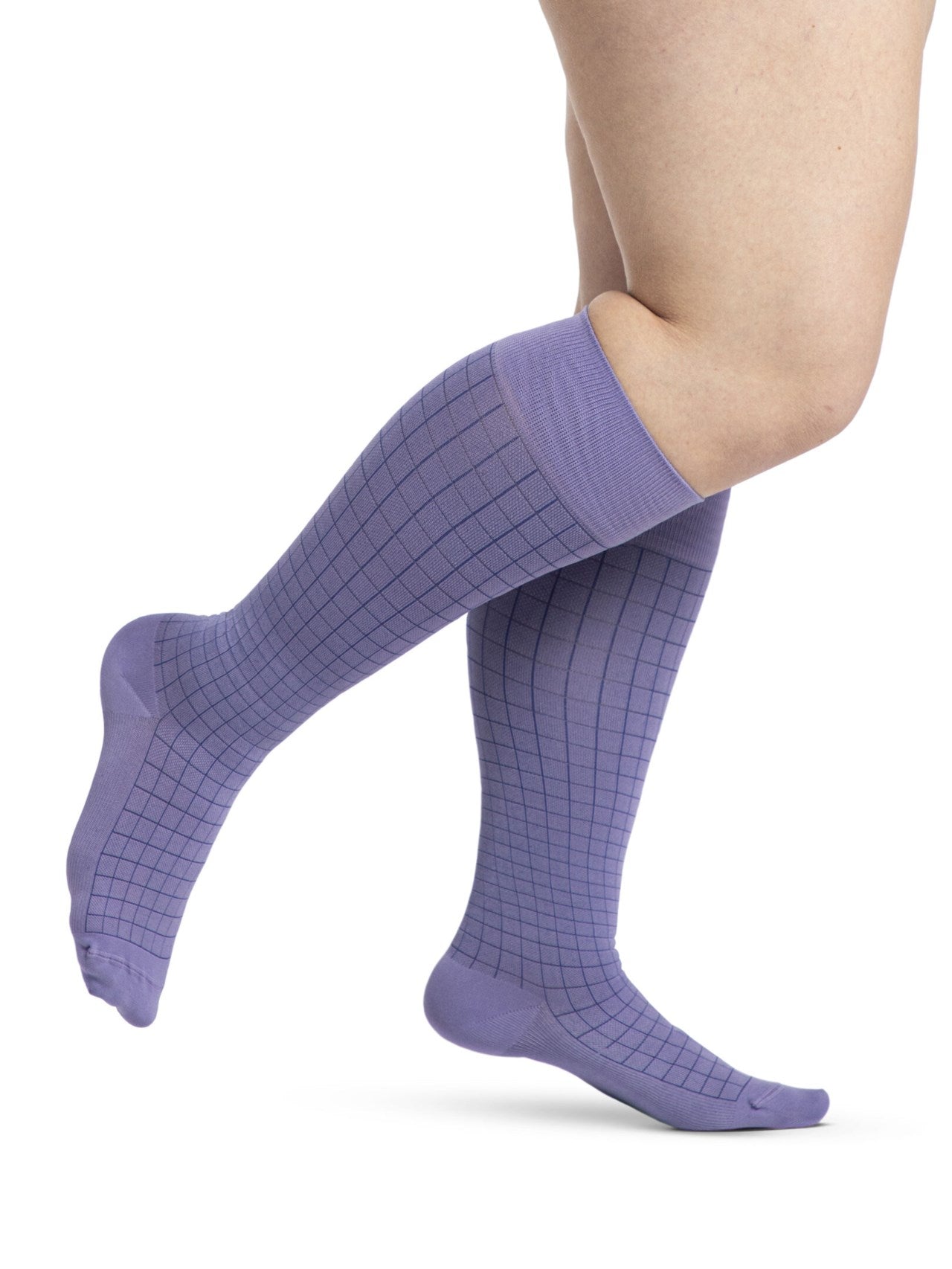 Legs of female model in Sigvaris Microfiber Patterns compression socks in wisteria.