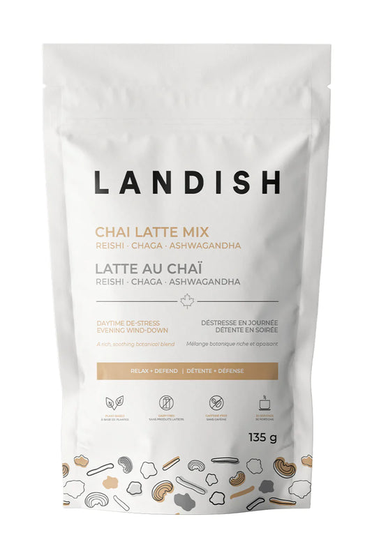 Front view of a package of Landish chai latte mix on white background.