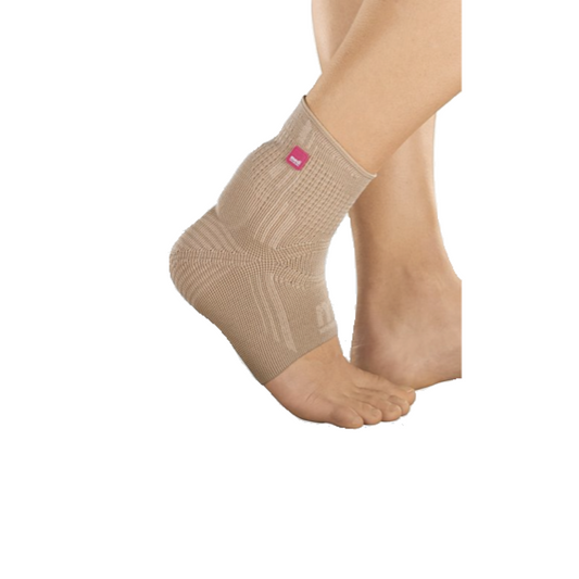 Feet of model in Achimed ankle support in beige.