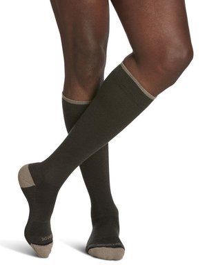 Legs of male model in Sigvaris Thermoregulating Wool compression socks in olive.