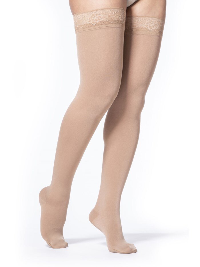 Legs of female model in Sigvaris Soft Opaque compression calf socks in caramel.