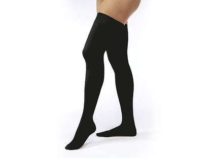 Legs of model in thigh-high JOBST Opaque compression tights in black.