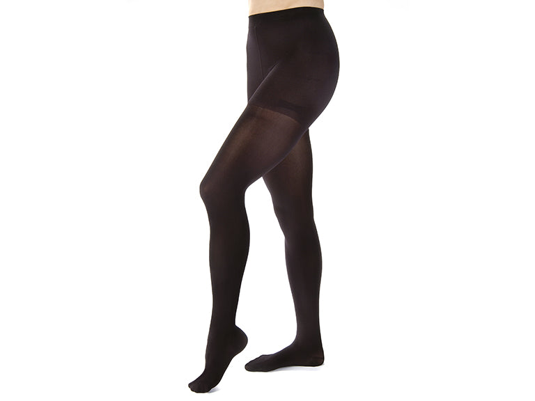 Lower body of model in waist-high JOBST Opaque compression tights.
