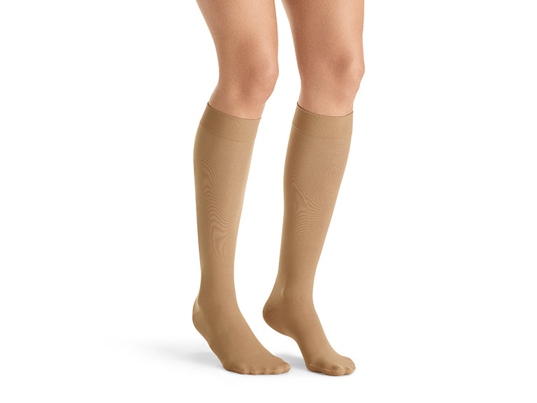 Lower legs of model in knee-high JOBST UltraSheer compression socks.