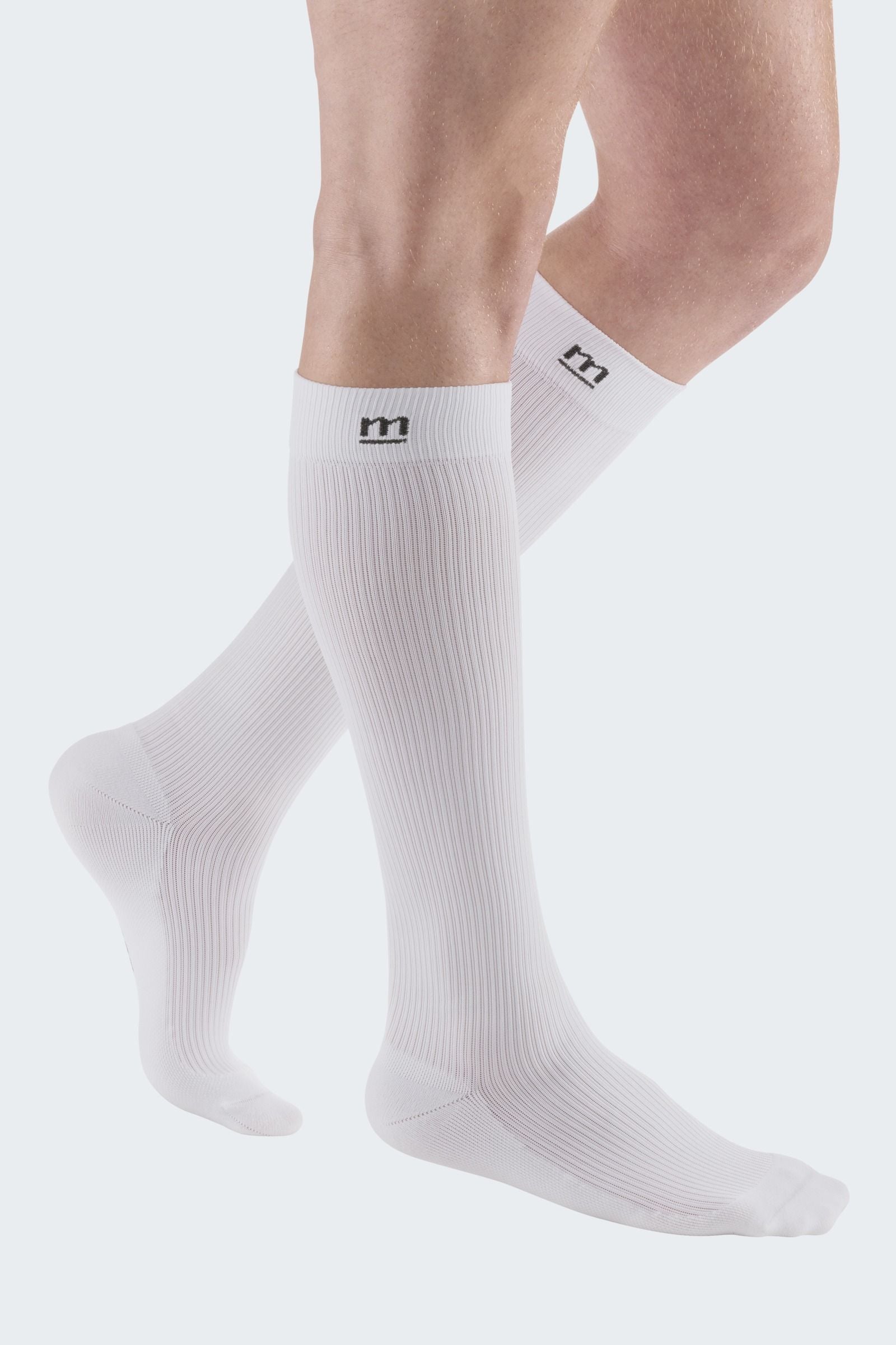 Lower legs of model in Mediven Active compression socks in white.