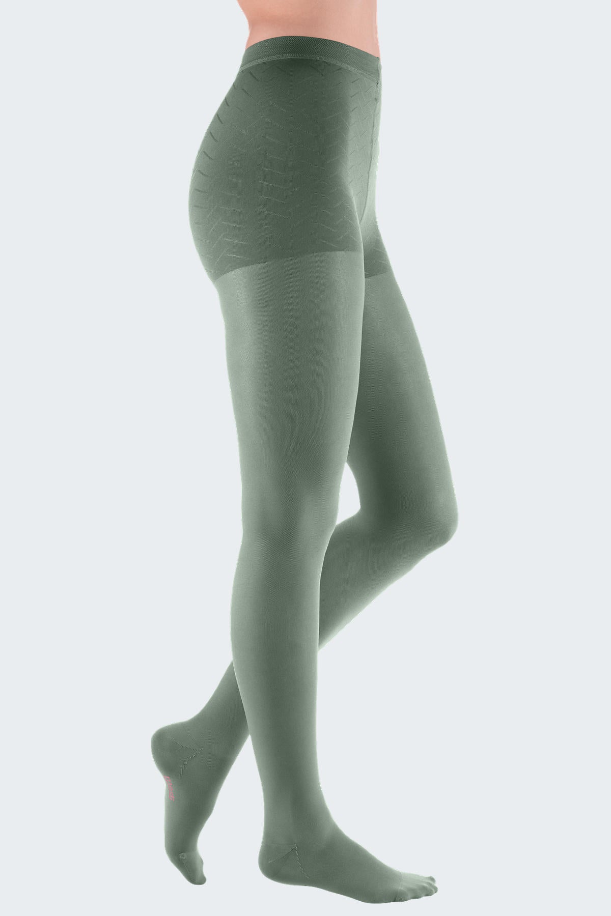 Lower body of female model in Mediven Elegance compression pantyhose in sage green.