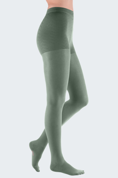 Lower body of female model in Mediven Elegance compression pantyhose in sage green.