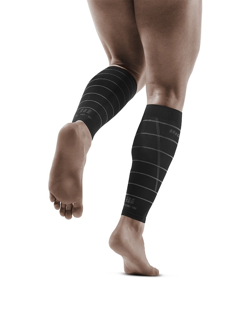 Lower legs of female model in CEP Reflective compression calf sleeves in black.